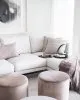 Maybe a pouf in leather or why not velvet?